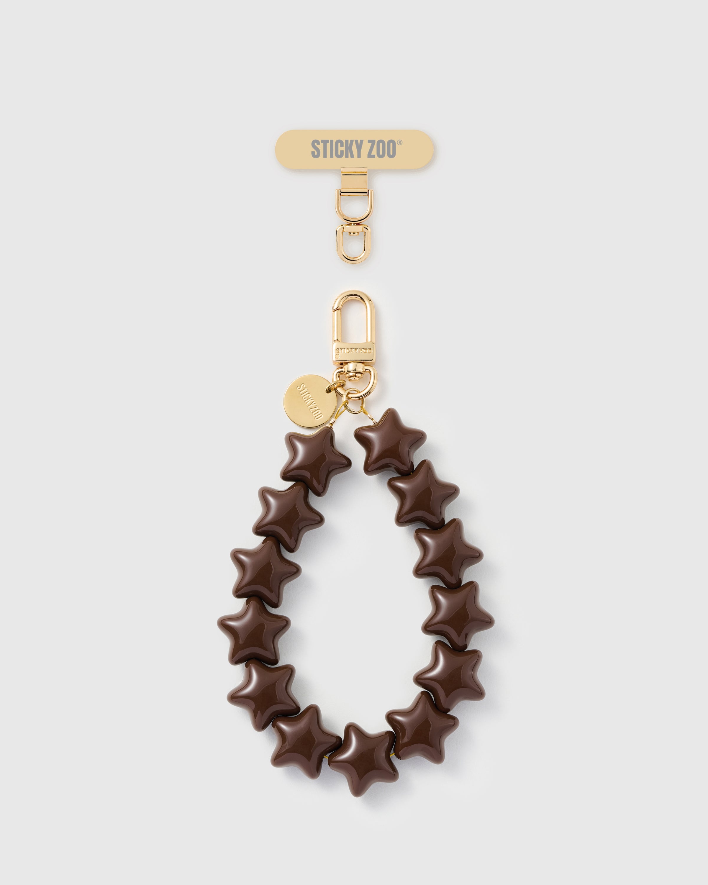 Quiet wish star phone strap — handmade cocoa star bead wristlet with 18K gold-plated carabiner and engraved STICKYZOO disc