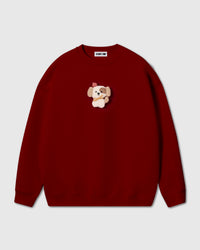 STICKYZOO CARDINAL PUPPY SWEATSHIRT in red featuring one hand-stitched plush puppy appliqué, designed in Amsterdam