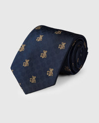 100% mulberry silk STICKYZOO Atlas Bear Tie in navy with hand-embroidered teddy bear motifs on geometric weave, rolled