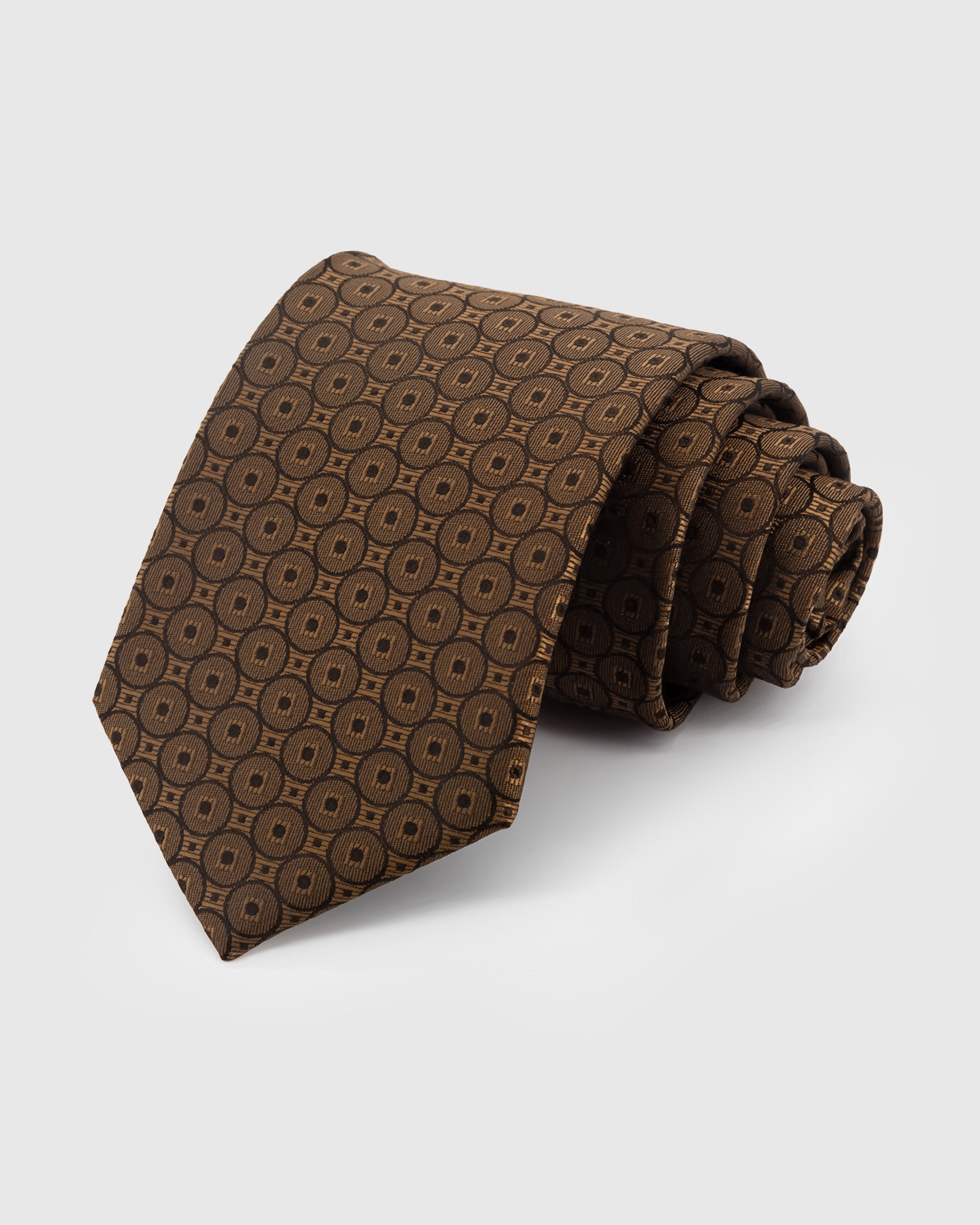 STICKYZOO Umber Coin Medallion Tie in hand-embroidered mulberry silk with concentric ring motifs, 45° bias-cut Italian method