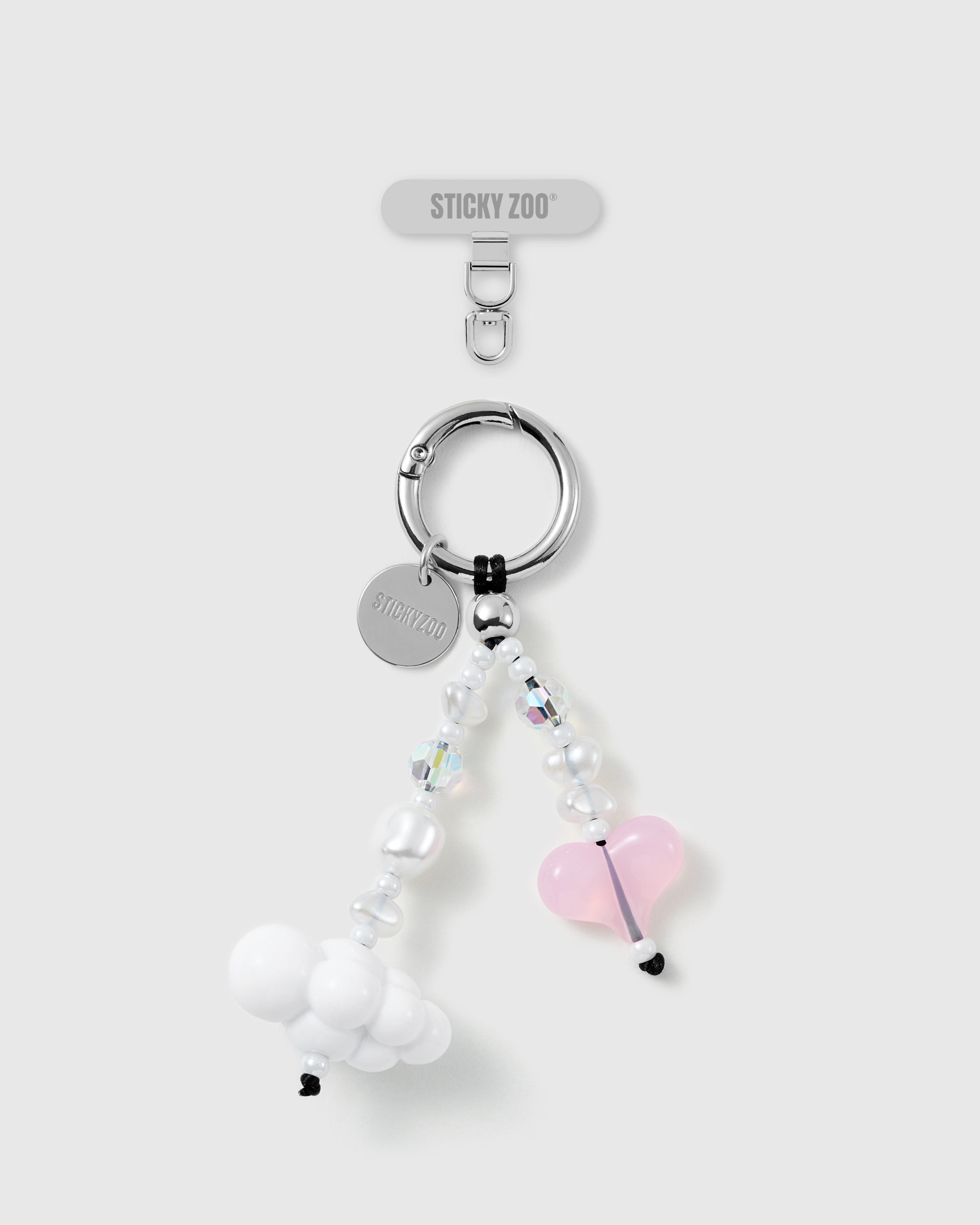 STICKYZOO Dream Cloud phone strap: white cloud bead and pink jelly heart on a beaded wrist strap with faux-pearl beads, silver-tone ring and card.