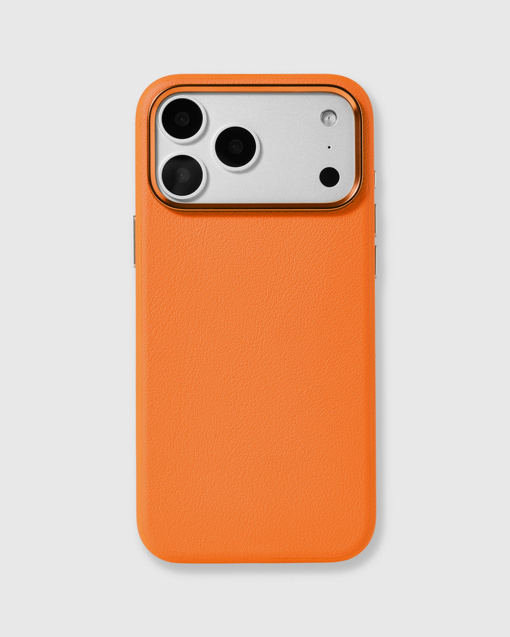 Orange fine-grain vegan leather iPhone case with a raised gold metal camera frame by STICKYZOO