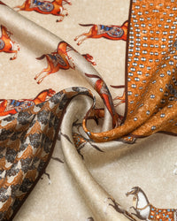 Silk equestrian patchwork scarf coiled through a leather ring showing the saffron frame and rust horses
