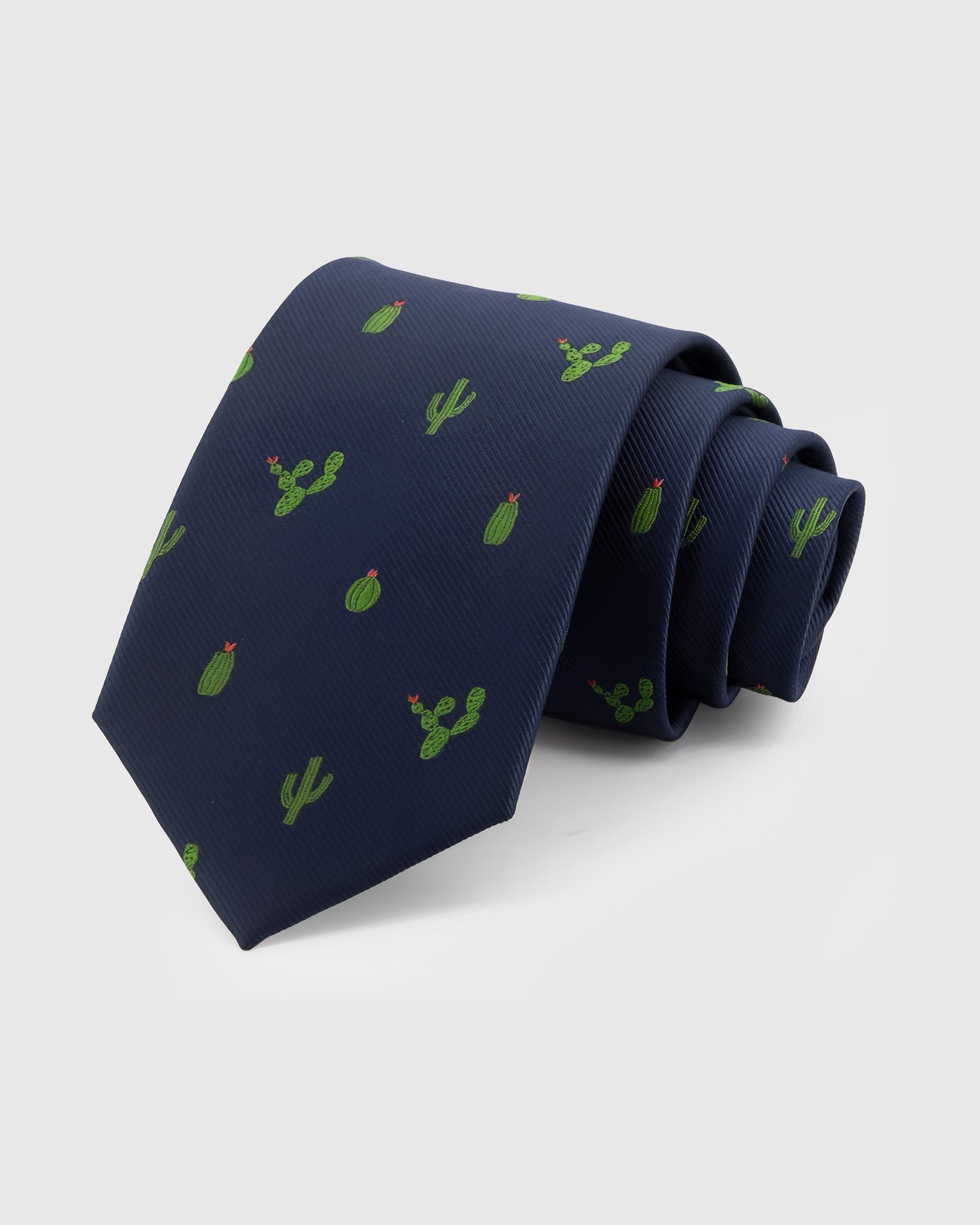 STICKYZOO Navy Cactus Tie in hand-embroidered mulberry silk with green cactus and red bloom motifs on navy ground, 45° bias-cut