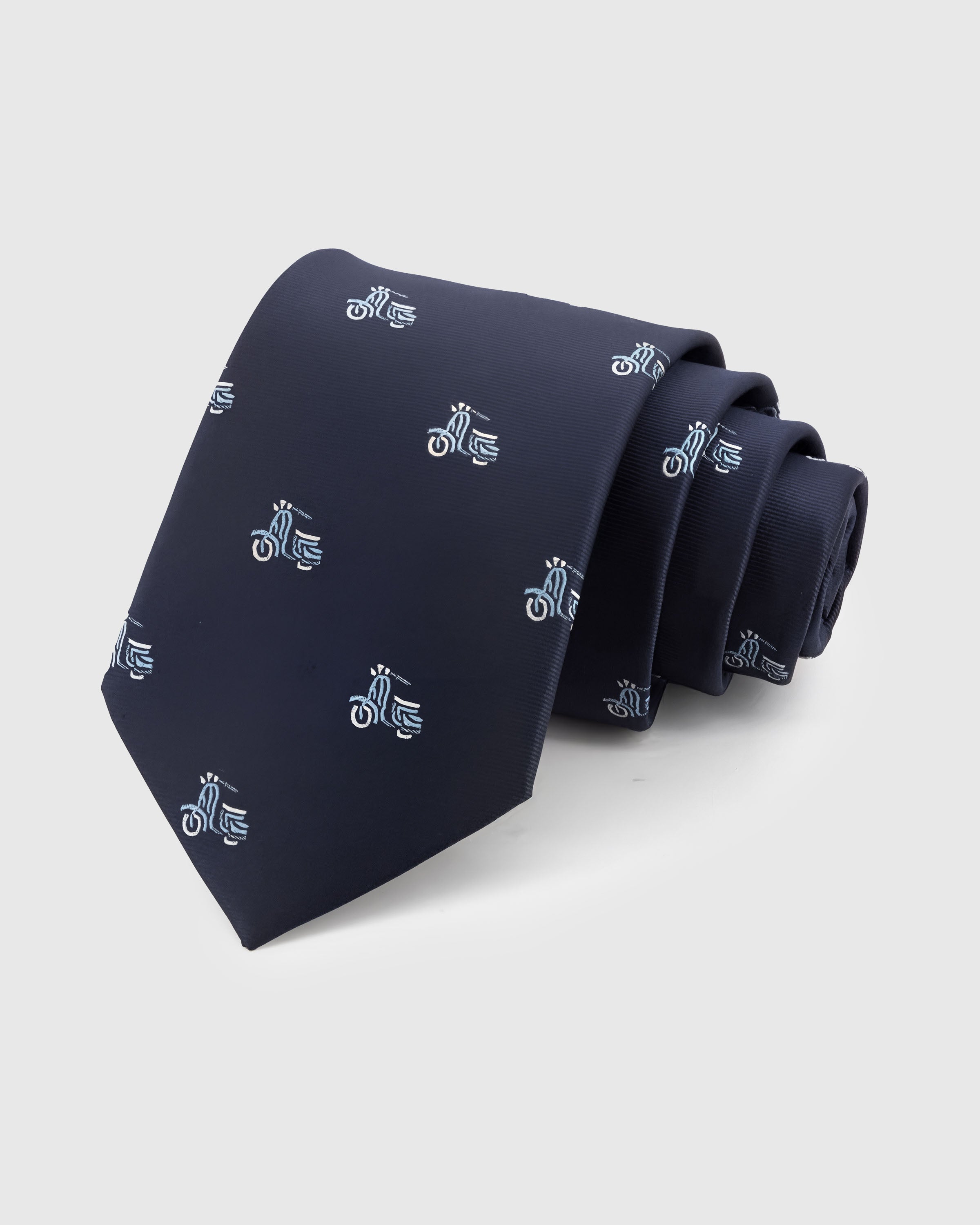 NAVY VESPA TIE — Hand-embroidered scooter detail on 100% mulberry silk in navy, showing embroidery texture and silk sheen