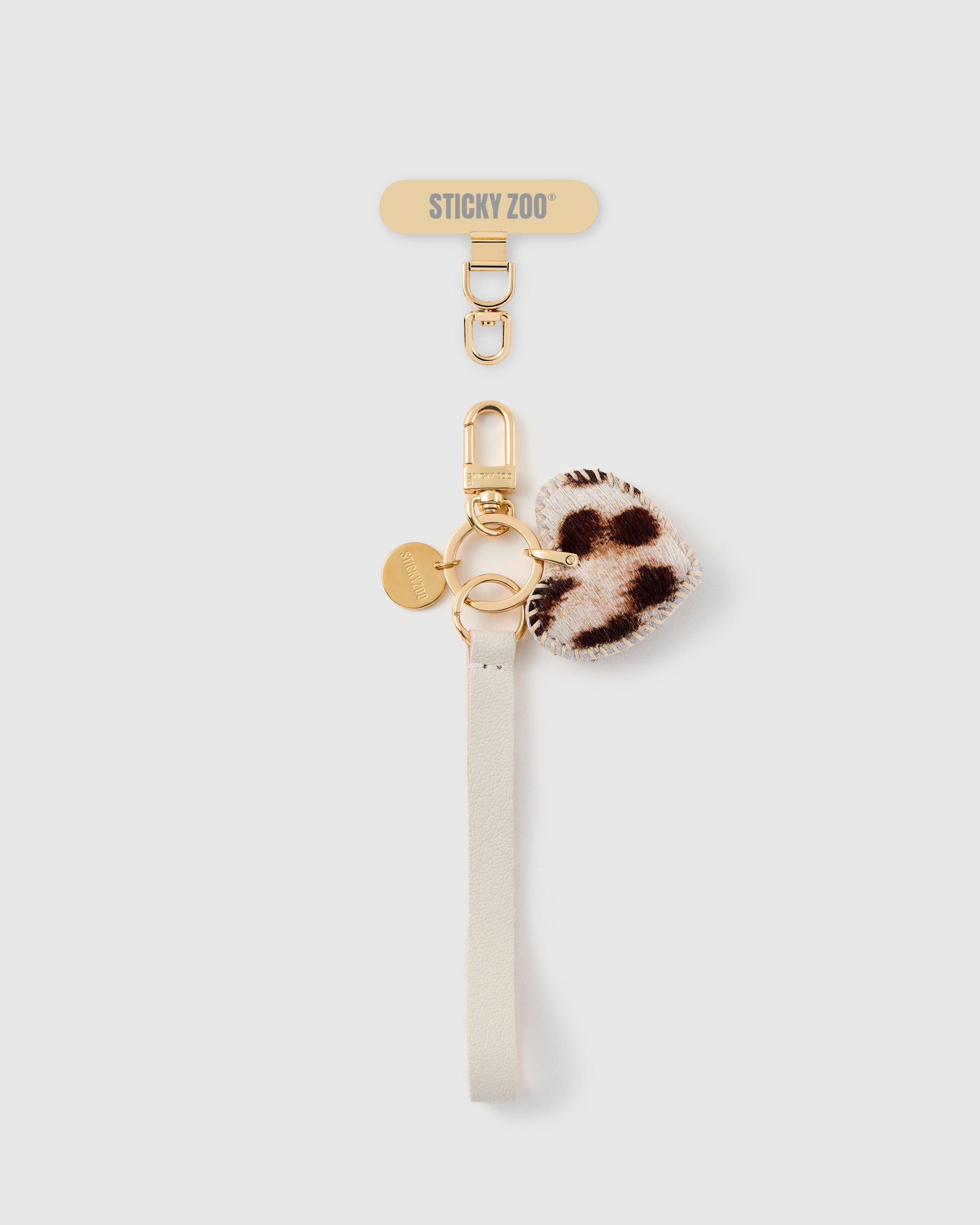 STICKYZOO snow leopard heart leather phone strap flat, ivory calf-hair heart charm on pebbled Alran leather with gold hook