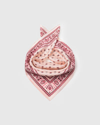 Silk tile scarf coiled to show the pure silk drape and the raspberry-on-blush print