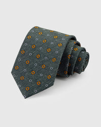 STICKYZOO Sage Floret Tie in hand-embroidered herringbone mulberry silk with amber floret and white diamond motifs, 45° bias-cut Italian method