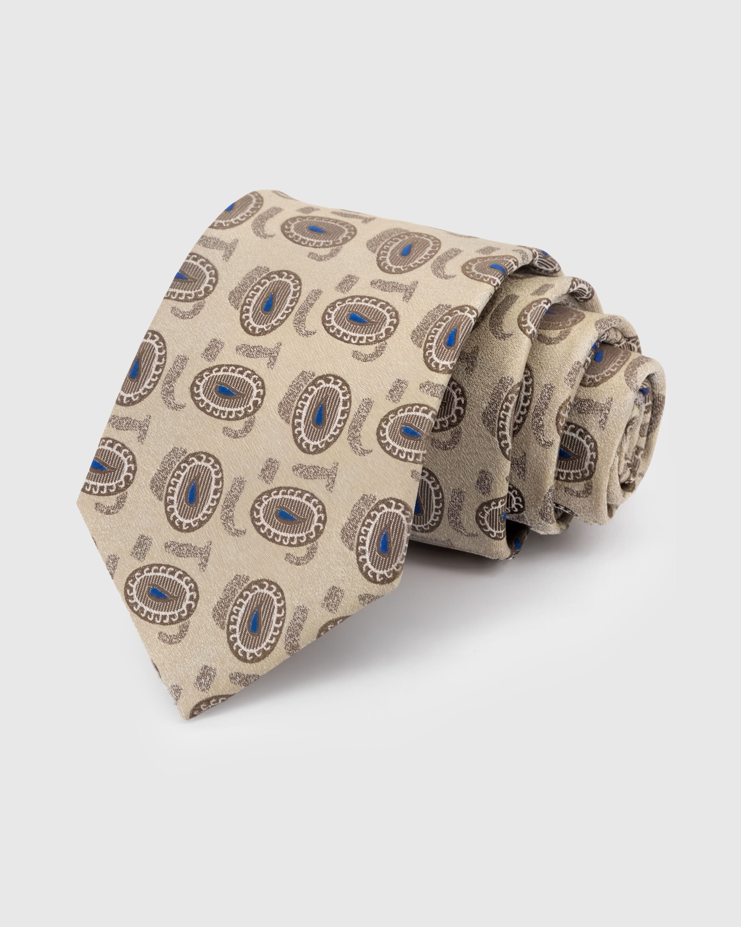 STICKYZOO Sandstone Paisley Tie in hand-embroidered mulberry silk with azure paisley medallions on sandstone ground, 45° bias-cut Italian method