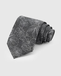 STICKYZOO Slate Botanical Tie in hand-embroidered mulberry silk with ivory botanical floral outlines on charcoal grey ground, 45° bias-cut