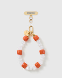 Handmade clementine-orange beaded phone strap by STICKYZOO with 18K gold-plated engraved hardware