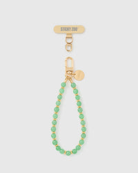 Sage green stone beaded phone strap with 18K gold-plated engraved hardware by STICKYZOO