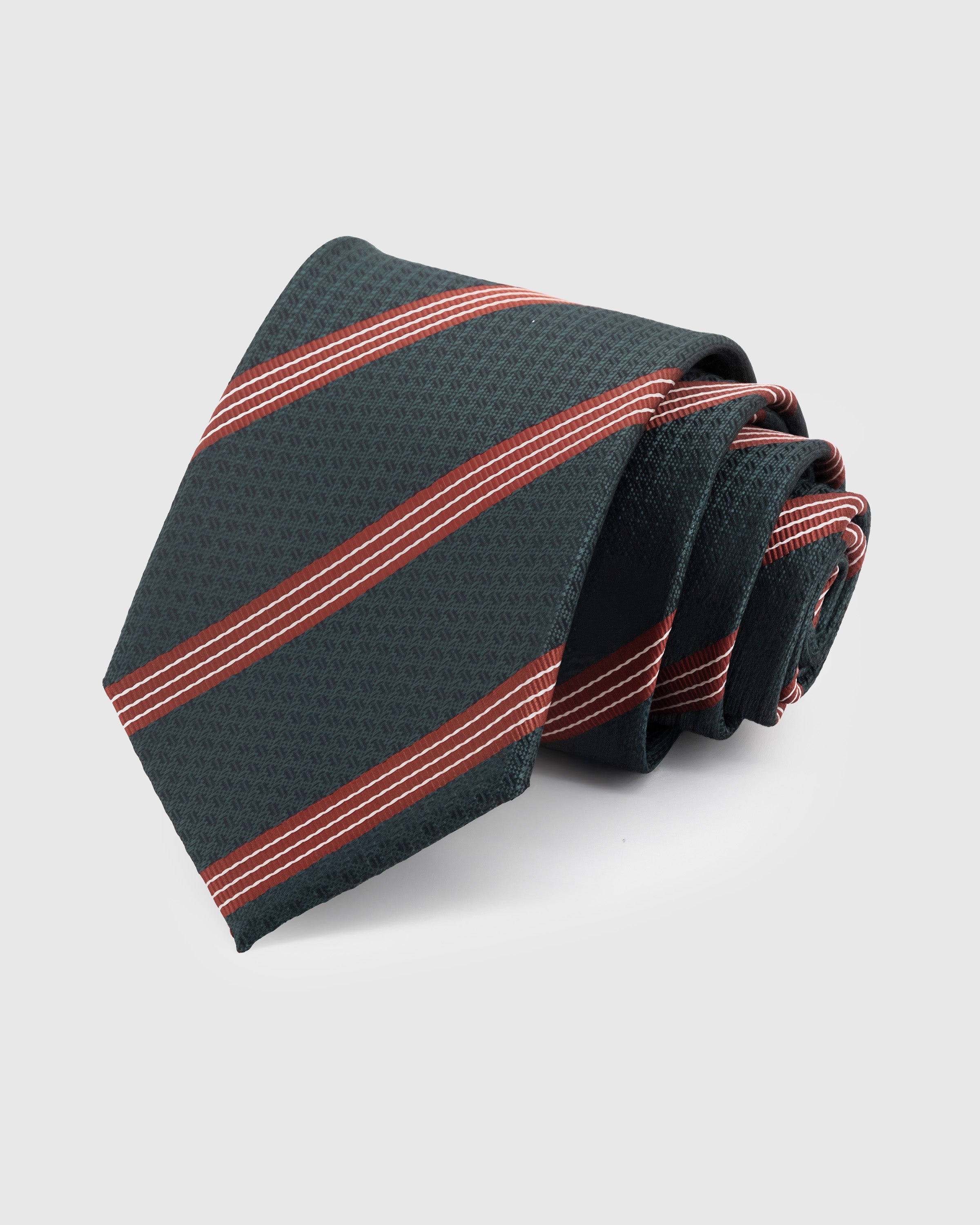 FOREST TRIPLE STRIPE TIE — Hand-embroidered triple stripe detail on 100% mulberry silk in forest green, showing embroidery texture and silk sheen