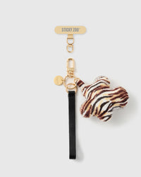 STICKYZOO tiger flower leather phone strap — black Alran strap, tiger calf-hair charm and gold hardware