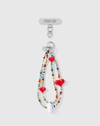 Handmade multi-strand phone strap with three red glass hearts and colorful seed beads by STICKYZOO