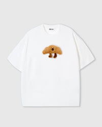 STICKYZOO Runaway Croissant T-Shirt in beige colorway showing croissant plush character
