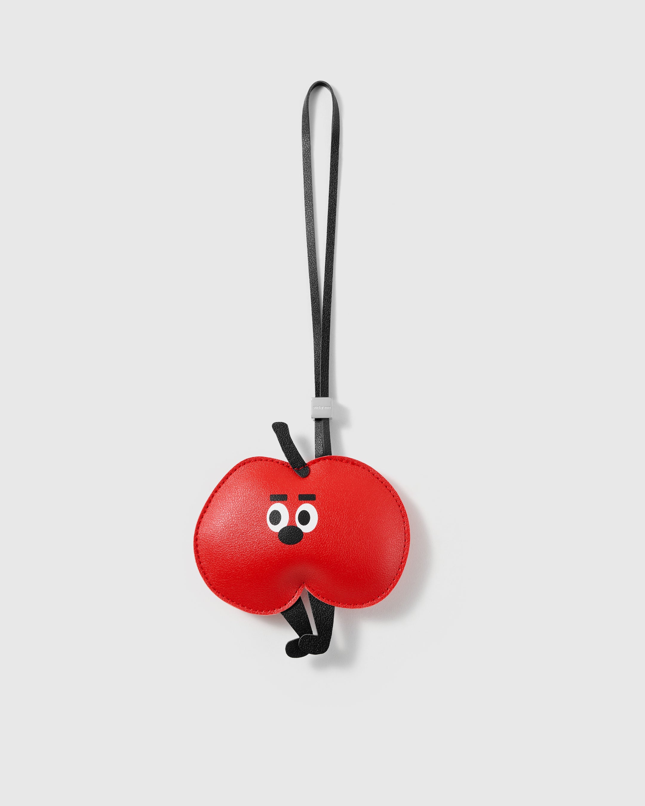 Handmade red French Alran leather apple bag charm with engraved 18K gold-plated hardware by STICKYZOO
