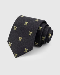 STICKYZOO CHARCOAL KOALA TIE — 100% mulberry silk with hand-embroidered gold-toned embroidered koala motifs on dark charcoal with herringbone texture ground
