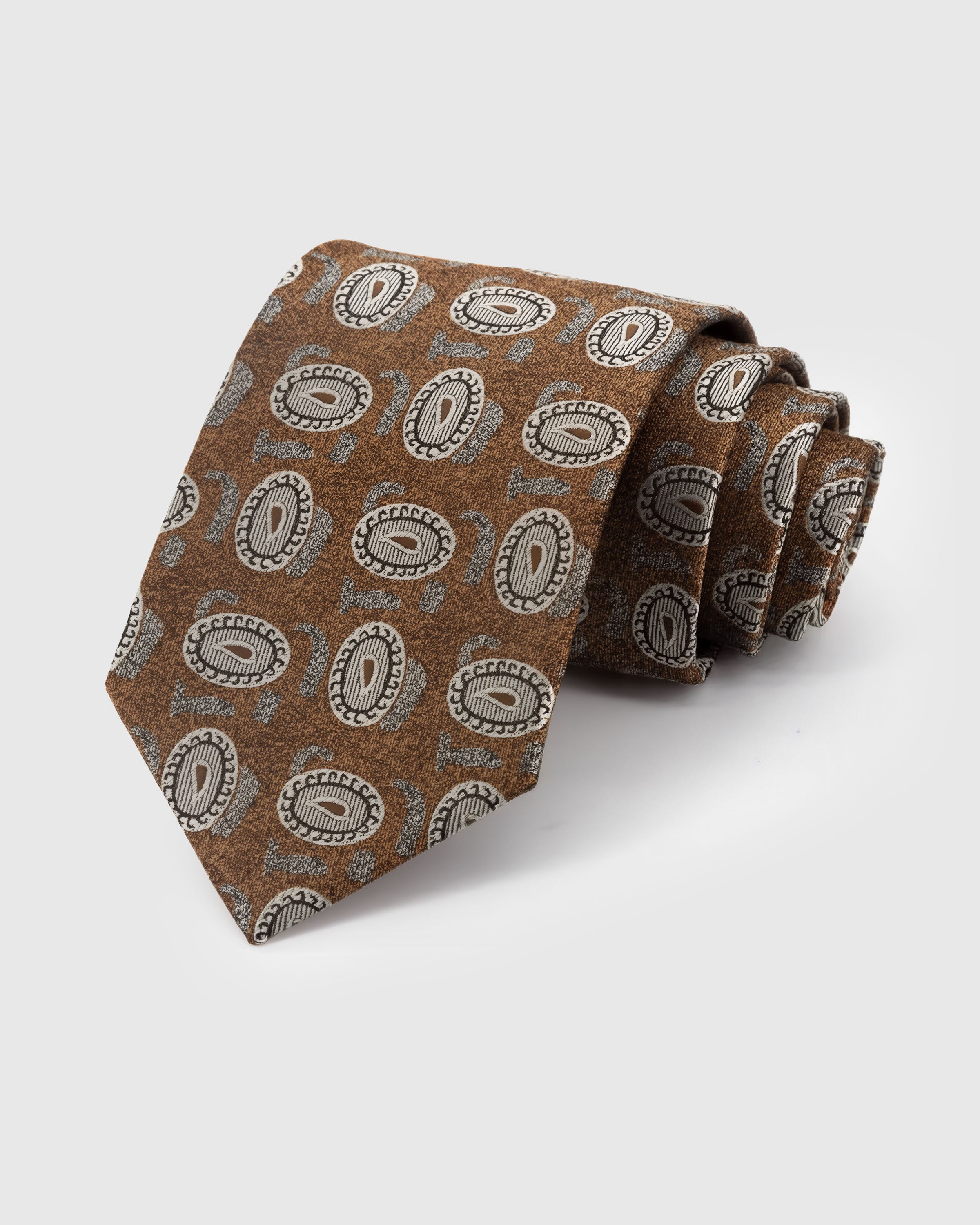 STICKYZOO Tawny Paisley Tie in hand-embroidered mulberry silk with ivory paisley medallions on tawny ground, 45° bias-cut Italian method