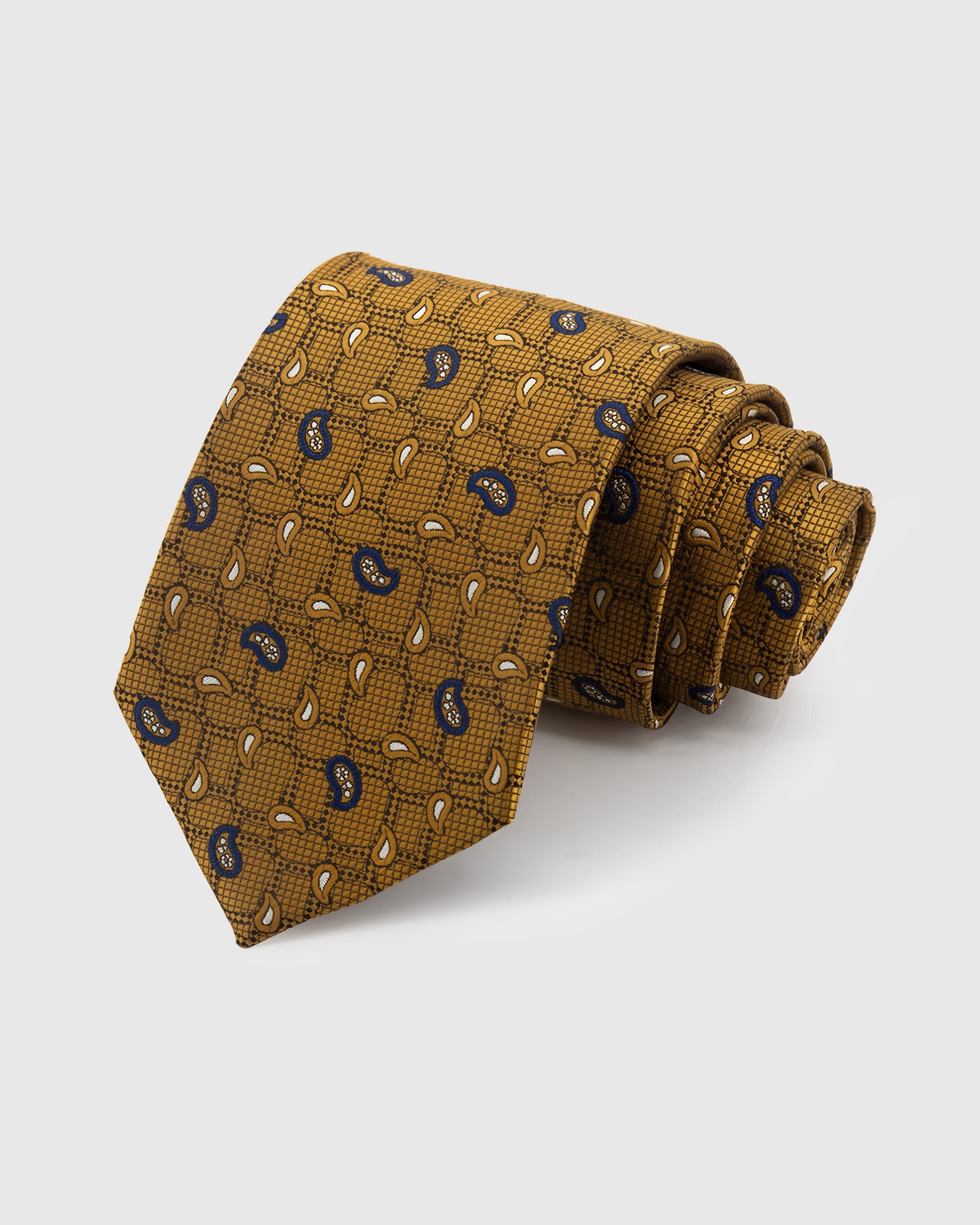 STICKYZOO Amber Scattered Paisley Tie in hand-embroidered mulberry silk with navy paisley drops on crosshatch ground, 45° bias-cut