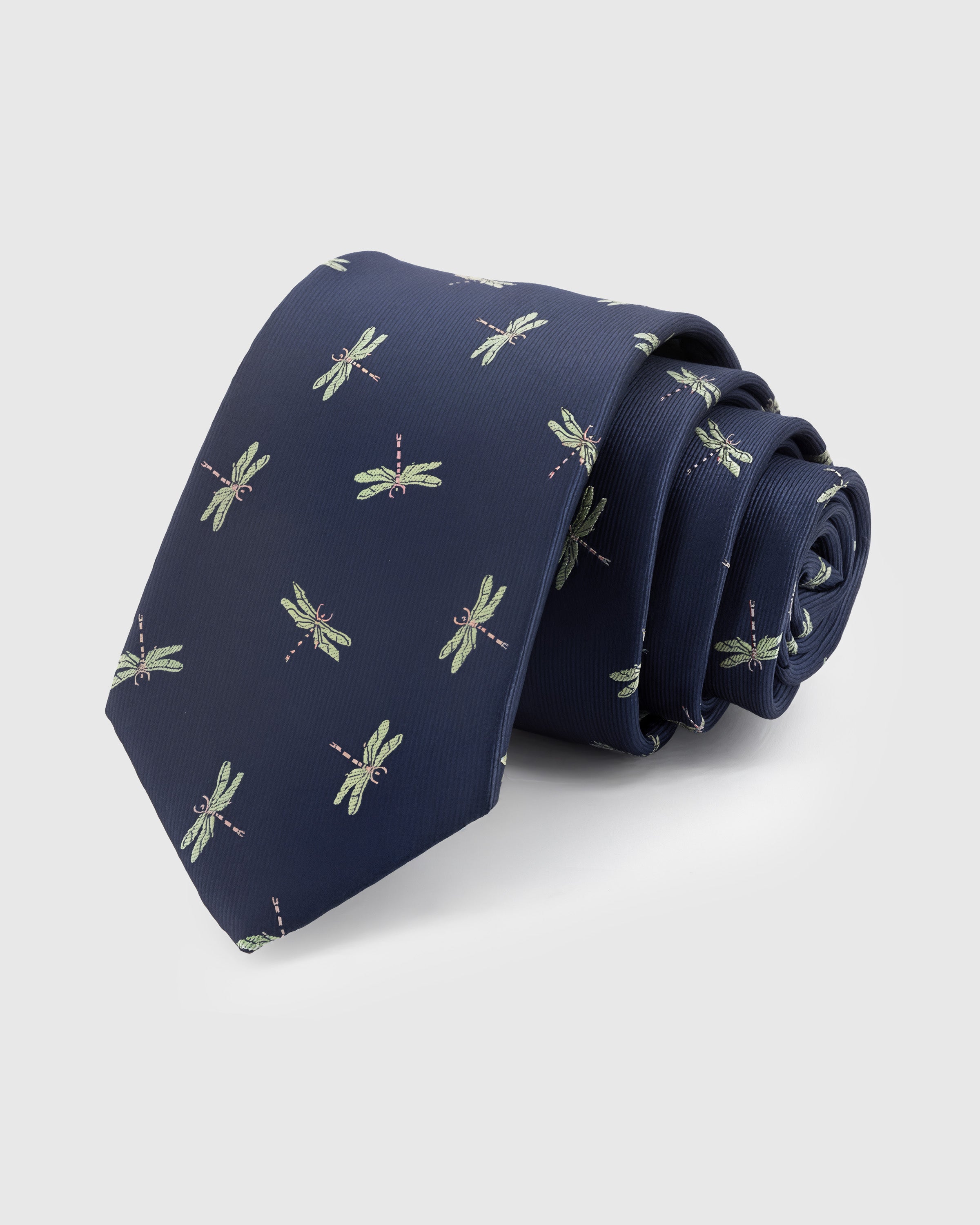 STICKYZOO Navy Dragonfly Tie in hand-embroidered mulberry silk with sage green dragonfly motifs on deep navy ground, 45° bias-cut