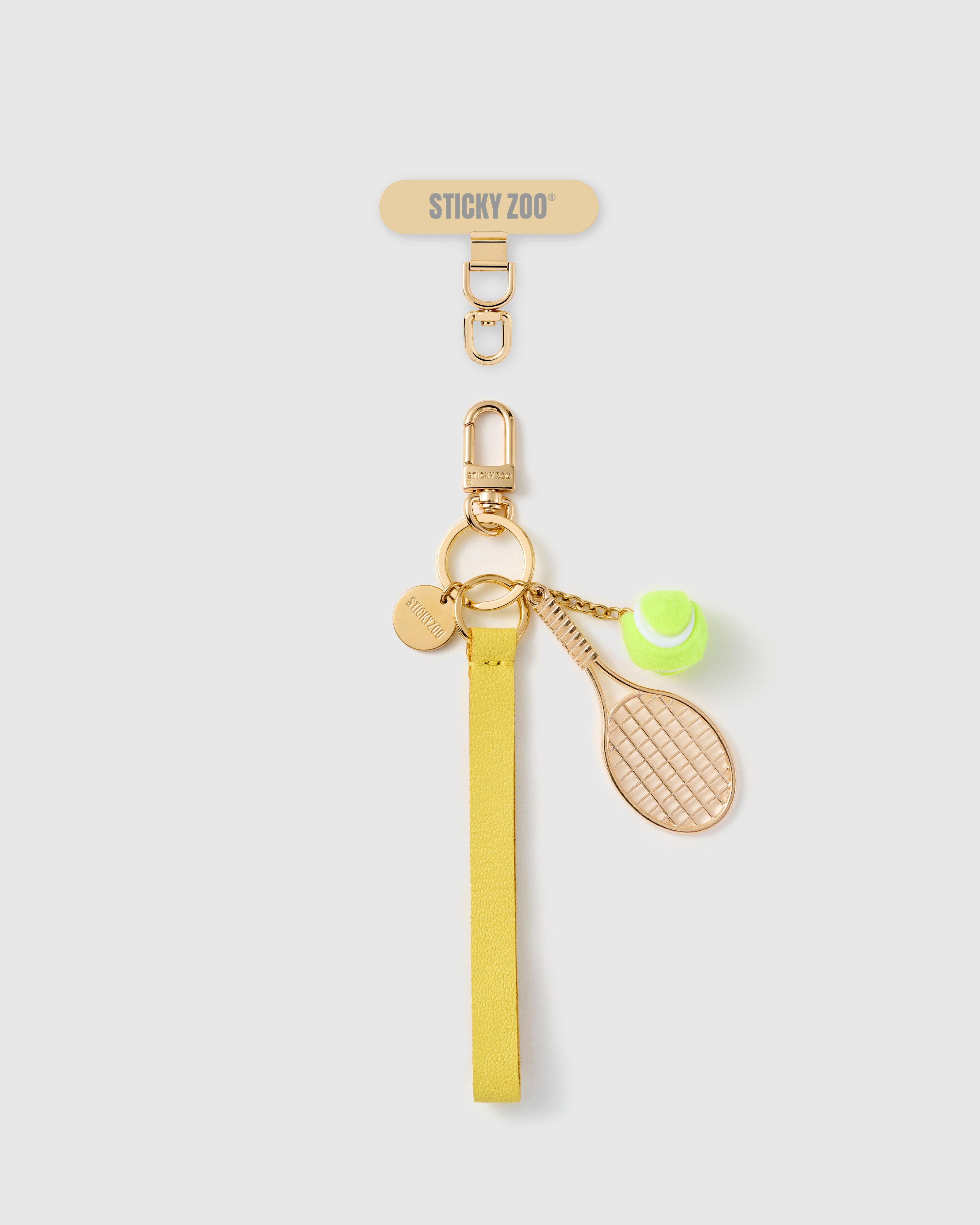 Handmade French Alran saffron yellow leather phone strap with gold tennis racquet and hand-felted tennis ball charms, 18K gold STICKYZOO hardware