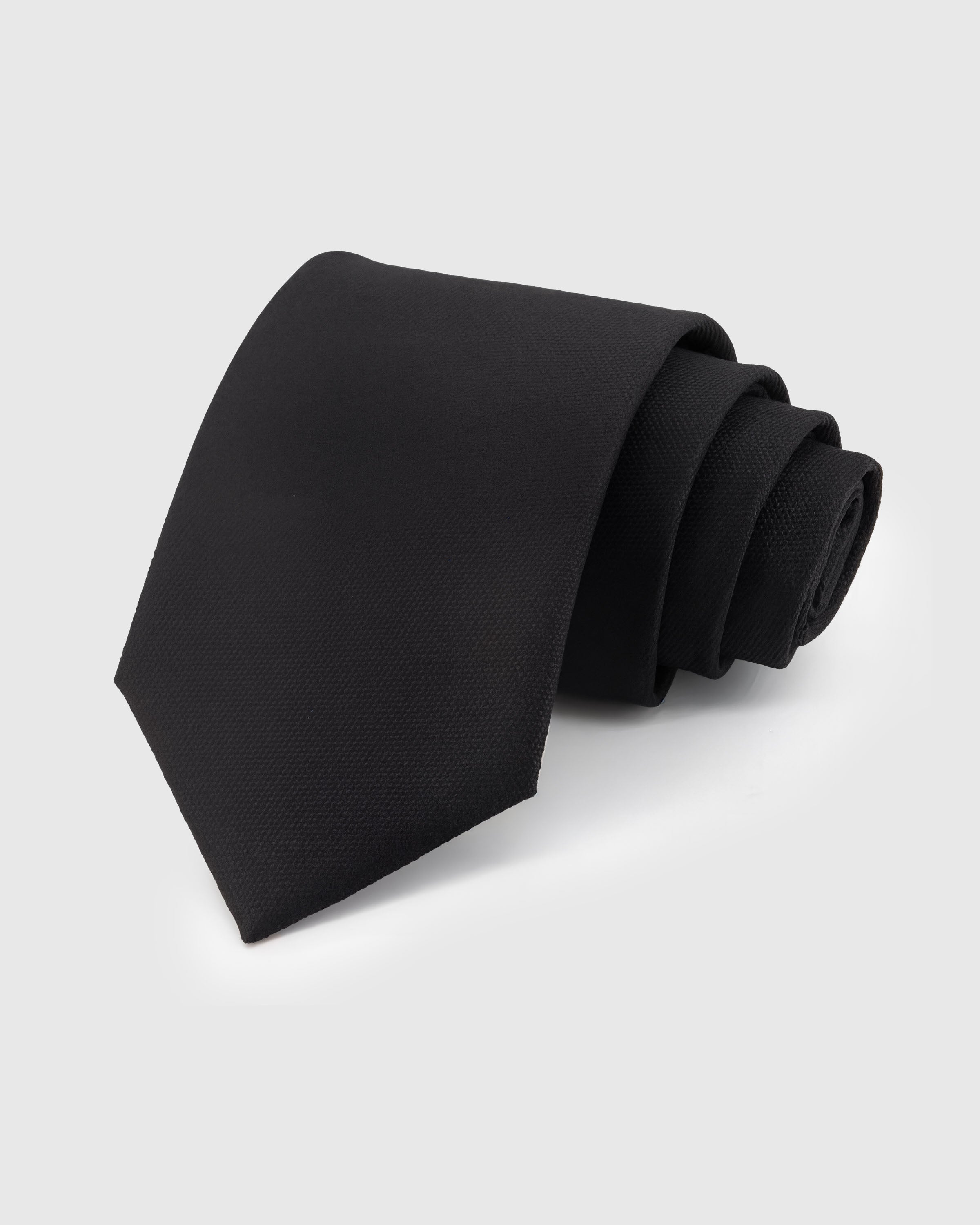 STICKYZOO Onyx Silk Tie — hand-embroidered black mulberry silk with solid textured pattern