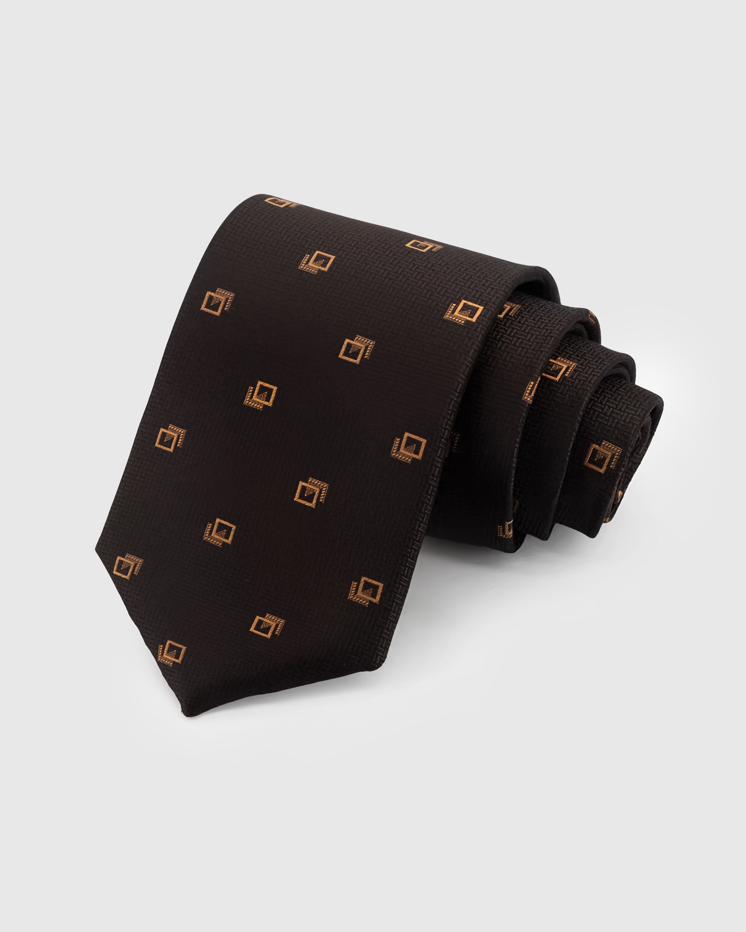 STICKYZOO Espresso Crest Tie in hand-embroidered basket-weave mulberry silk with gold geometric crest motifs, 45° bias-cut Italian method