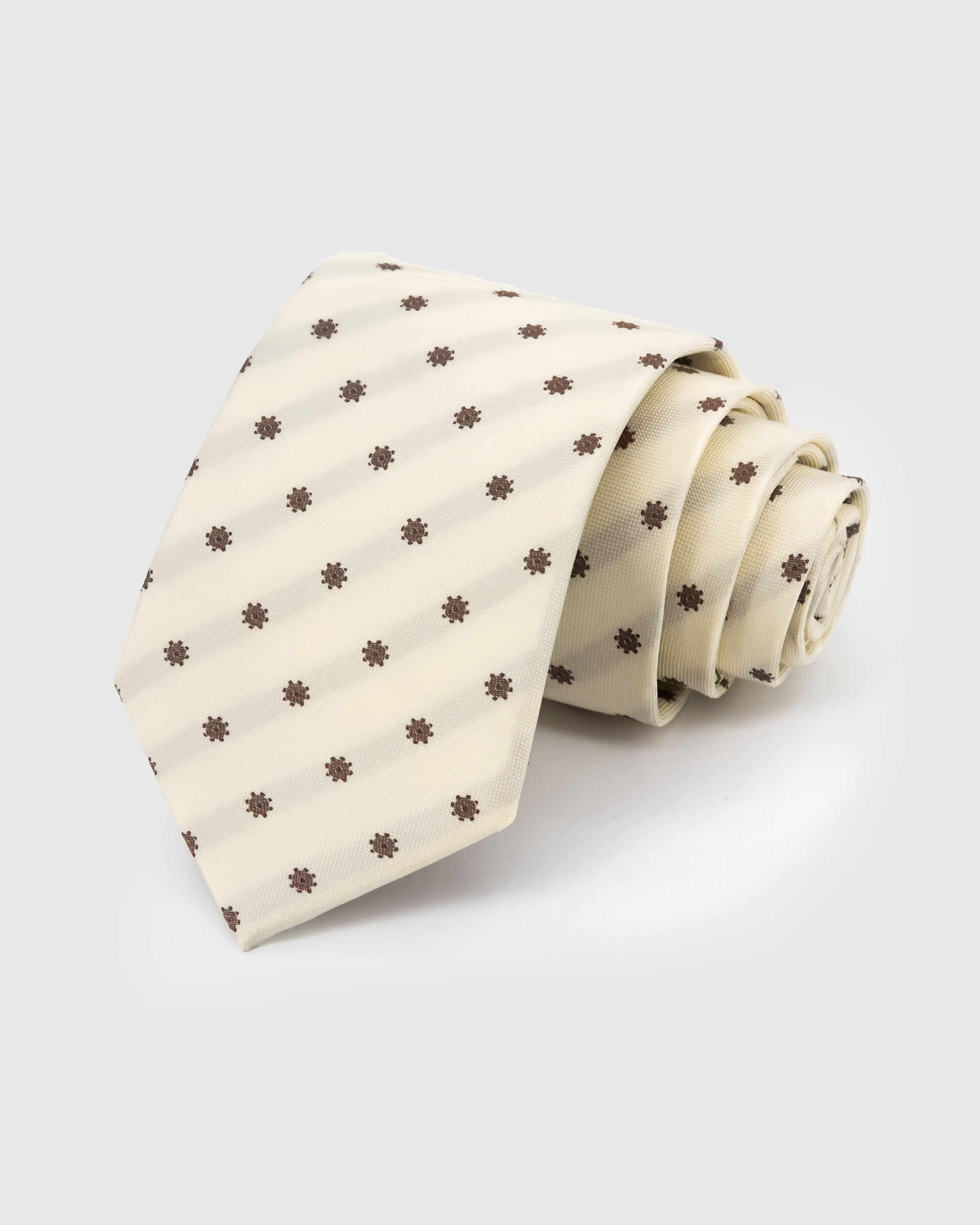 STICKYZOO Ivory Floret Tie in hand-embroidered mulberry silk with cocoa floret dots on ivory ground, 45° bias-cut Italian method