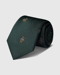 100% mulberry silk STICKYZOO Forest Terrier Tie in forest green with hand-embroidered terrier motifs on geometric weave, rolled