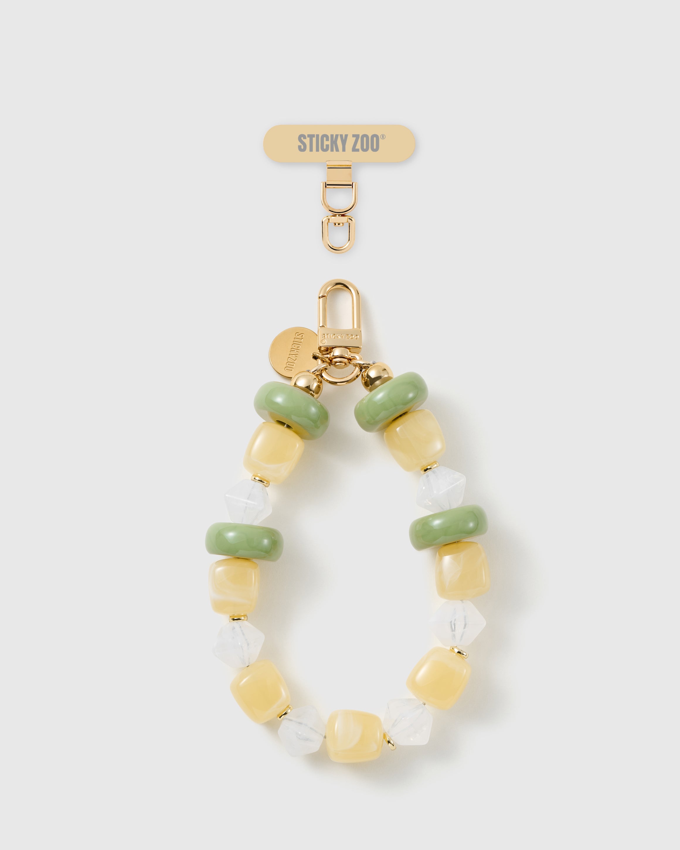 Handmade lemon-lime beaded phone strap by STICKYZOO with 18K gold-plated engraved hardware
