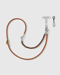 STICKYZOO adjustable cross-body phone strap in caramel cord with a black-and-copper braided accent and silver hardware