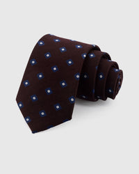 STICKYZOO Mocha Square Tie in hand-embroidered mulberry silk with navy foulard motifs on dark mocha ground, 45° bias-cut