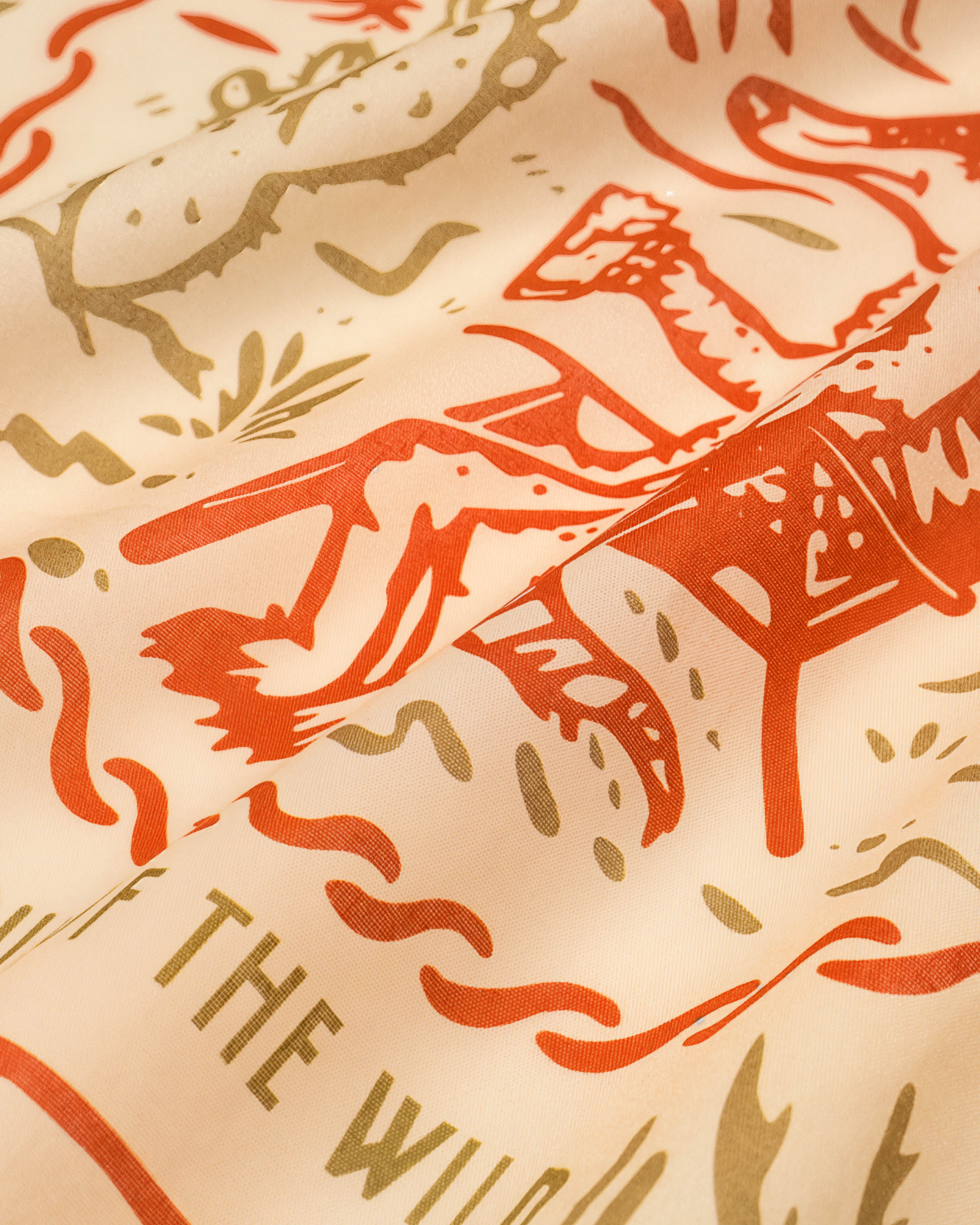 STICKYZOO desert lounge silk scarf showing the printed coyote and mountain motif in rust and olive ink
```