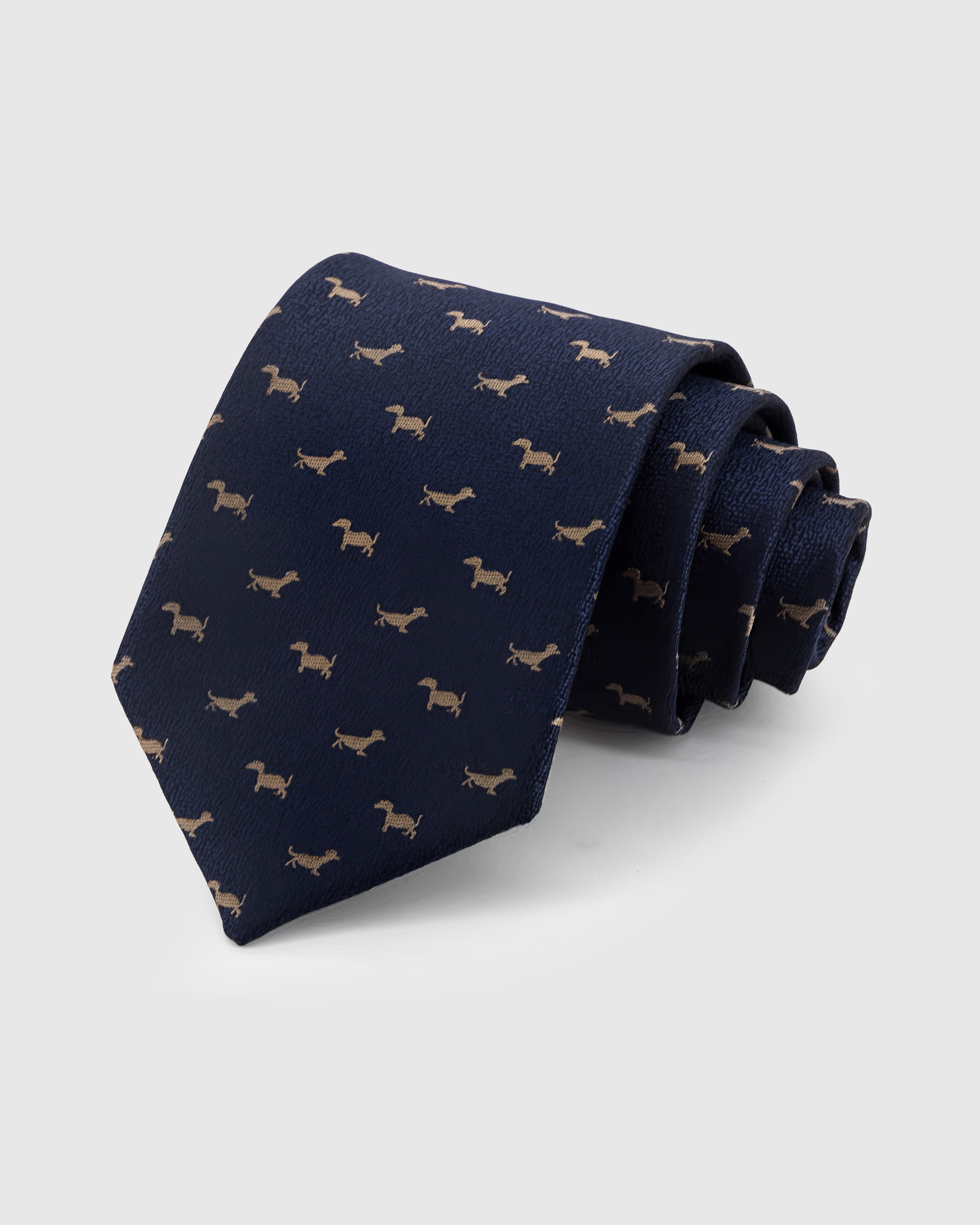 STICKYZOO Navy Dachshund Tie in hand-embroidered mulberry silk with gold dachshund motifs on navy textured ground, 45° bias-cut Italian method
