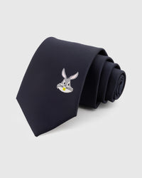 MIDNIGHT RABBIT TIE — Hand-embroidered rabbit detail on 100% mulberry silk in midnight navy, showing embroidery texture and silk sheen
