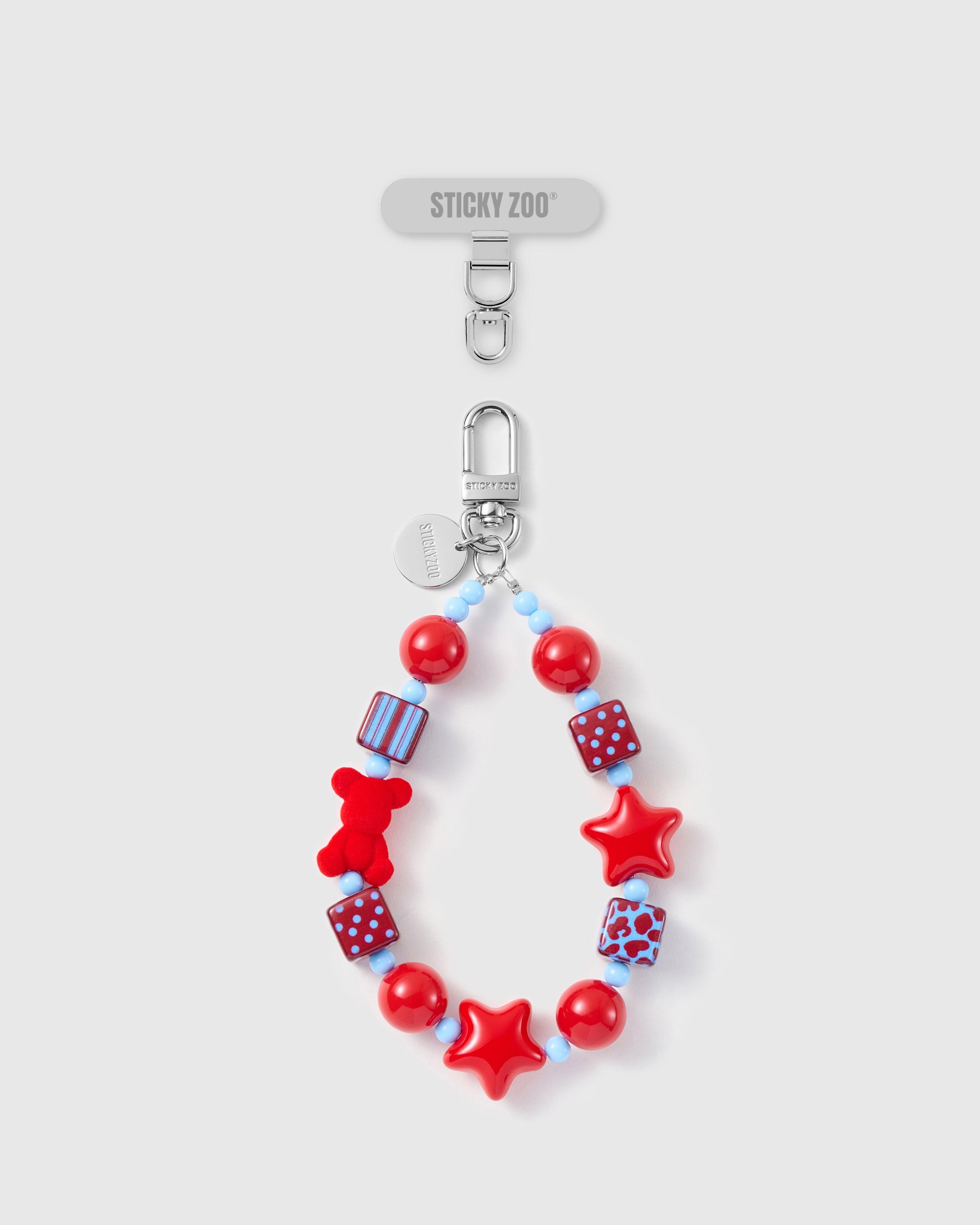 Handmade crimson beaded phone strap with red bear, stars, and pattern cube beads on silver-tone STICKYZOO hardware