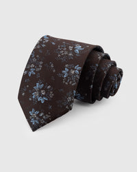 STICKYZOO Espresso Blossom Tie in hand-embroidered mulberry silk with blue floral cluster motifs, 45° bias-cut Italian method
