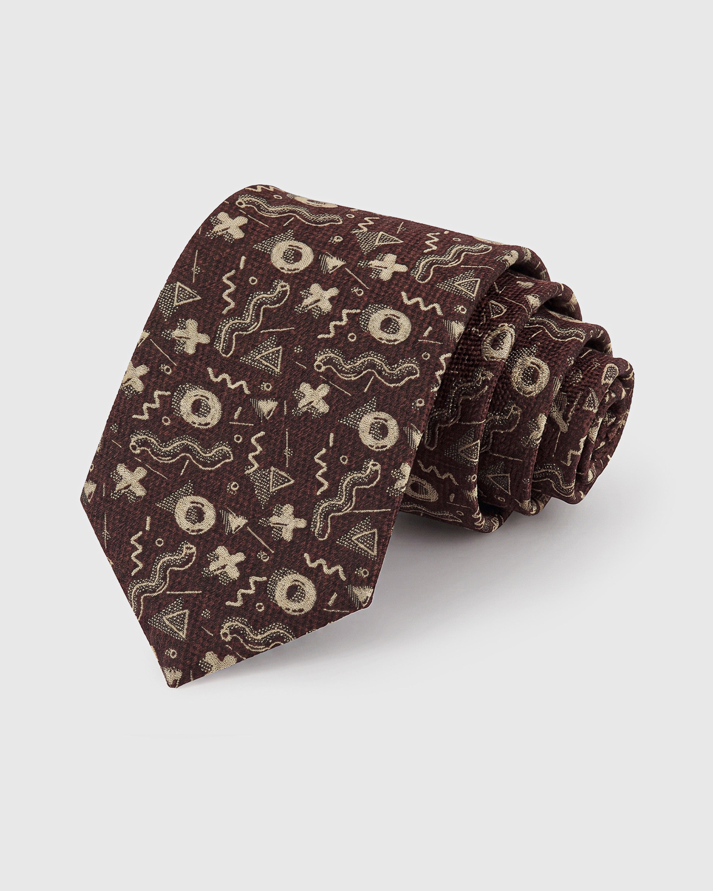 STICKYZOO Cocoa Abstract Motif Tie in hand-embroidered mulberry silk with cream geometric shapes on cocoa ground, 45° bias-cut
