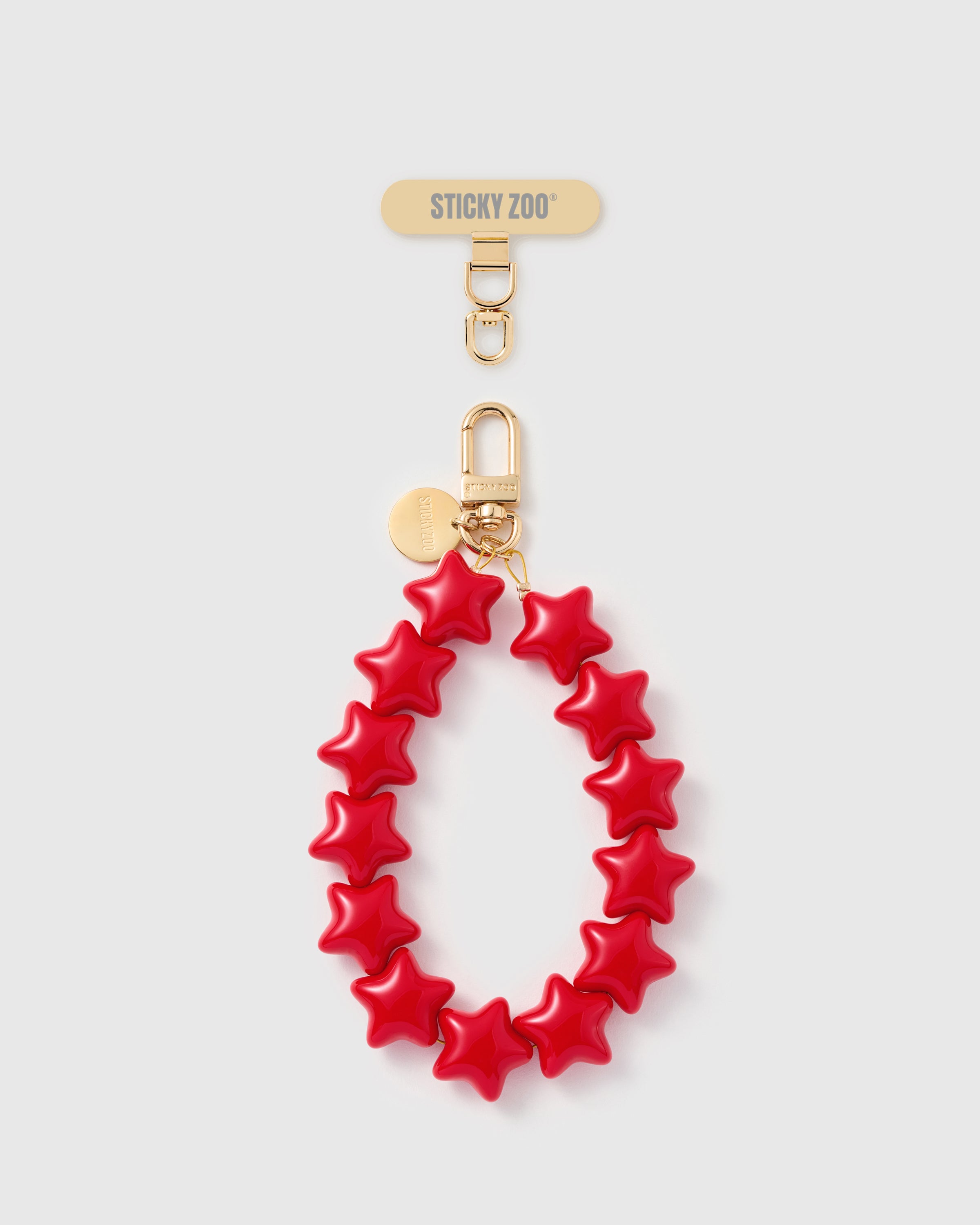 Handmade crimson five-point star bead phone strap with 18K gold-plated carabiner and engraved STICKYZOO disc — Rated 4.9 stars
