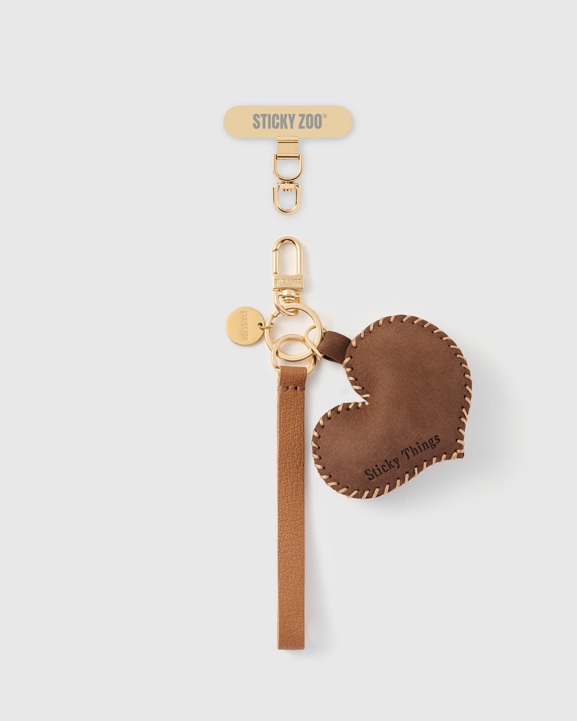 STICKYZOO cocoa heart leather phone strap — smooth brown leather heart, cognac Alran strap, gold hook and connector tab
