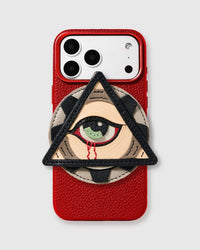 STICKYZOO All-Seeing Eye Charm Case — handmade French Alran leather eye-in-triangle charm on red vegan leather phone case with raised bezels.