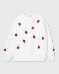 STICKYZOO Strawberry Sweatshirt in cream with eleven hand-stitched 3D plush red strawberry appliques scattered across front and sleeves