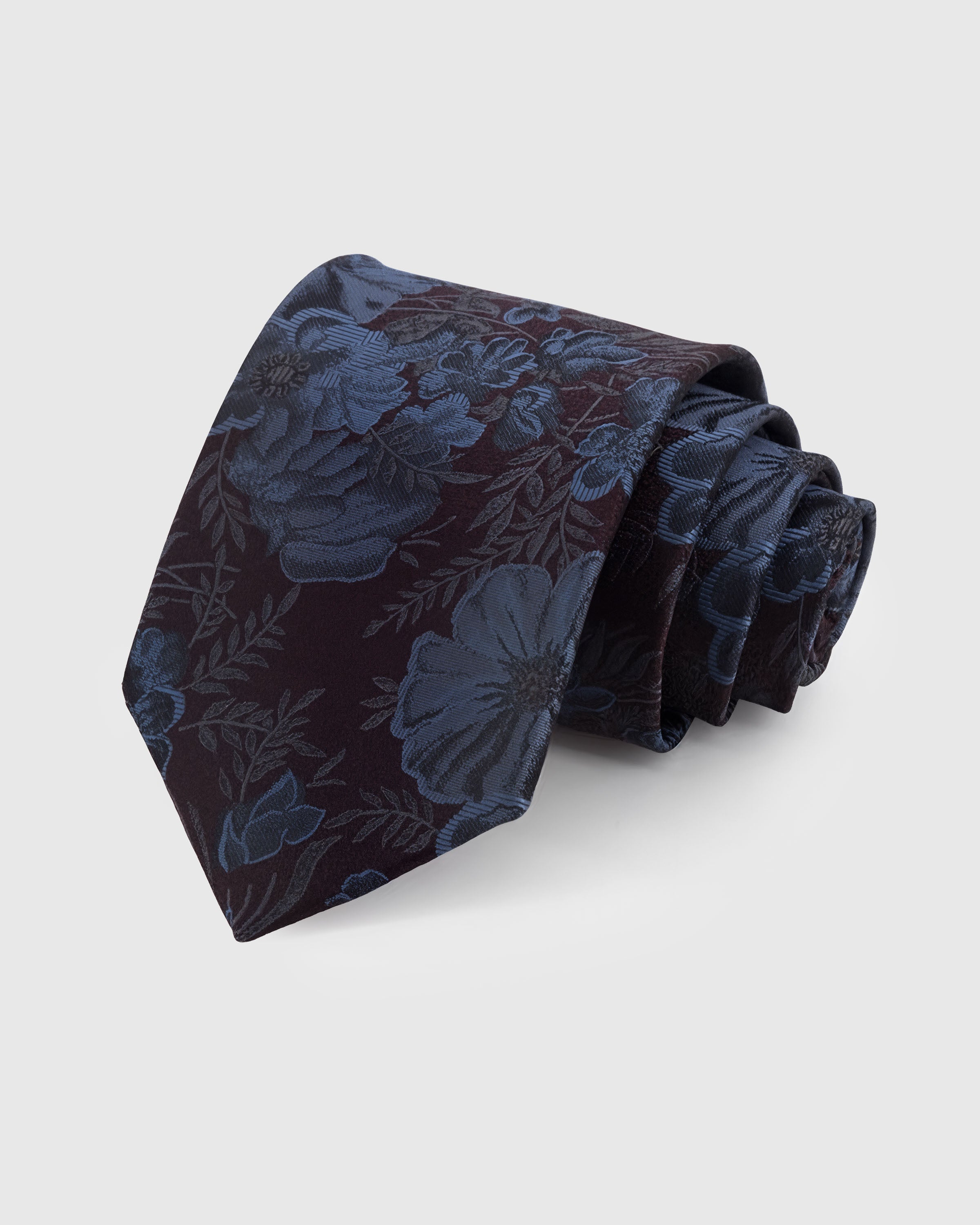 STICKYZOO PLUM PEONY TIE — 100% mulberry silk with hand-embroidered steel-blue peony blooms and delicate foliage on dark plum with burgundy undertones ground