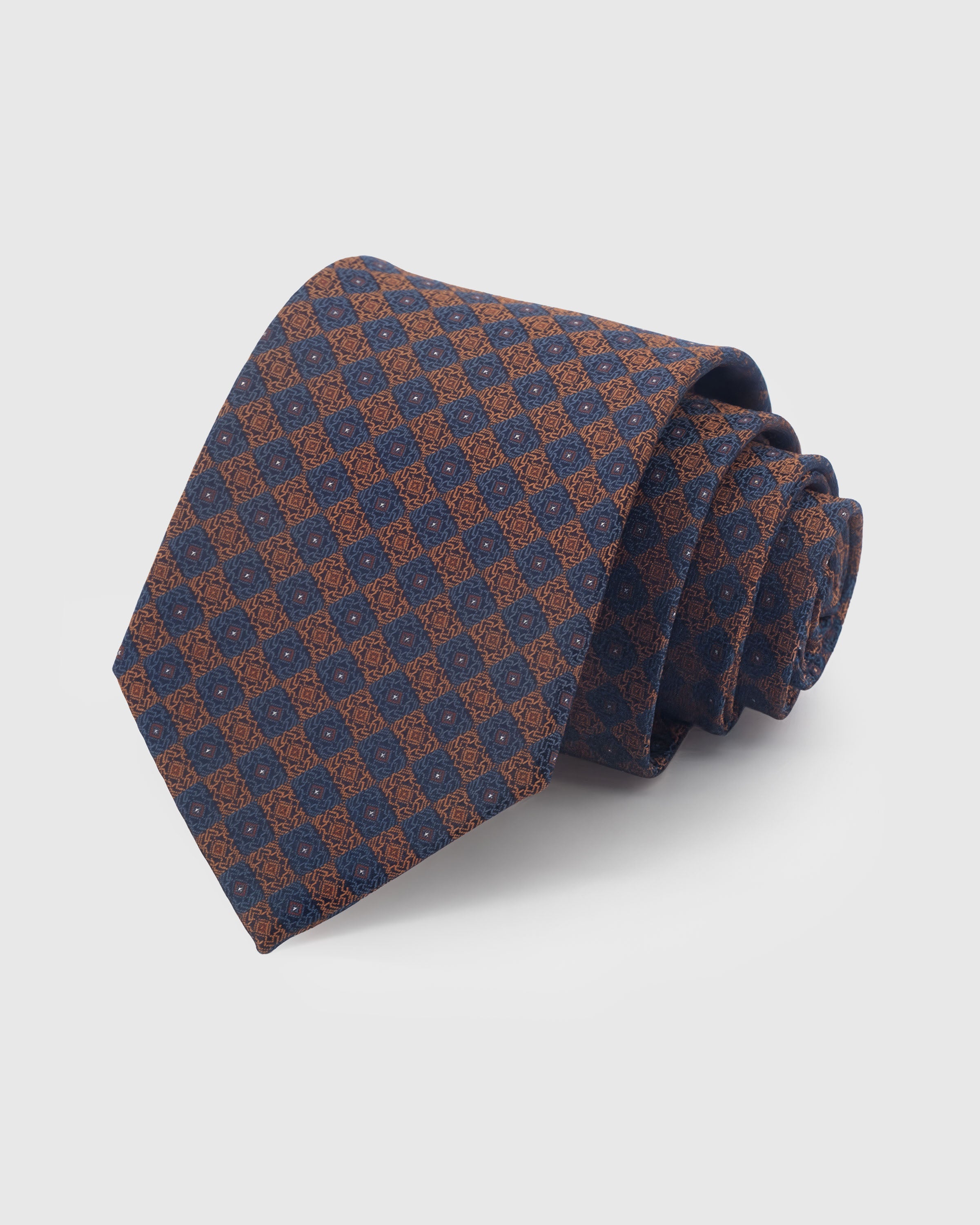 {100% mulberry silk weave} STICKYZOO MIDNIGHT COPPER MOSAIC TIE in hand-embroidered mulberry silk with mosaic tile motif, 45° bias-cut Italian method