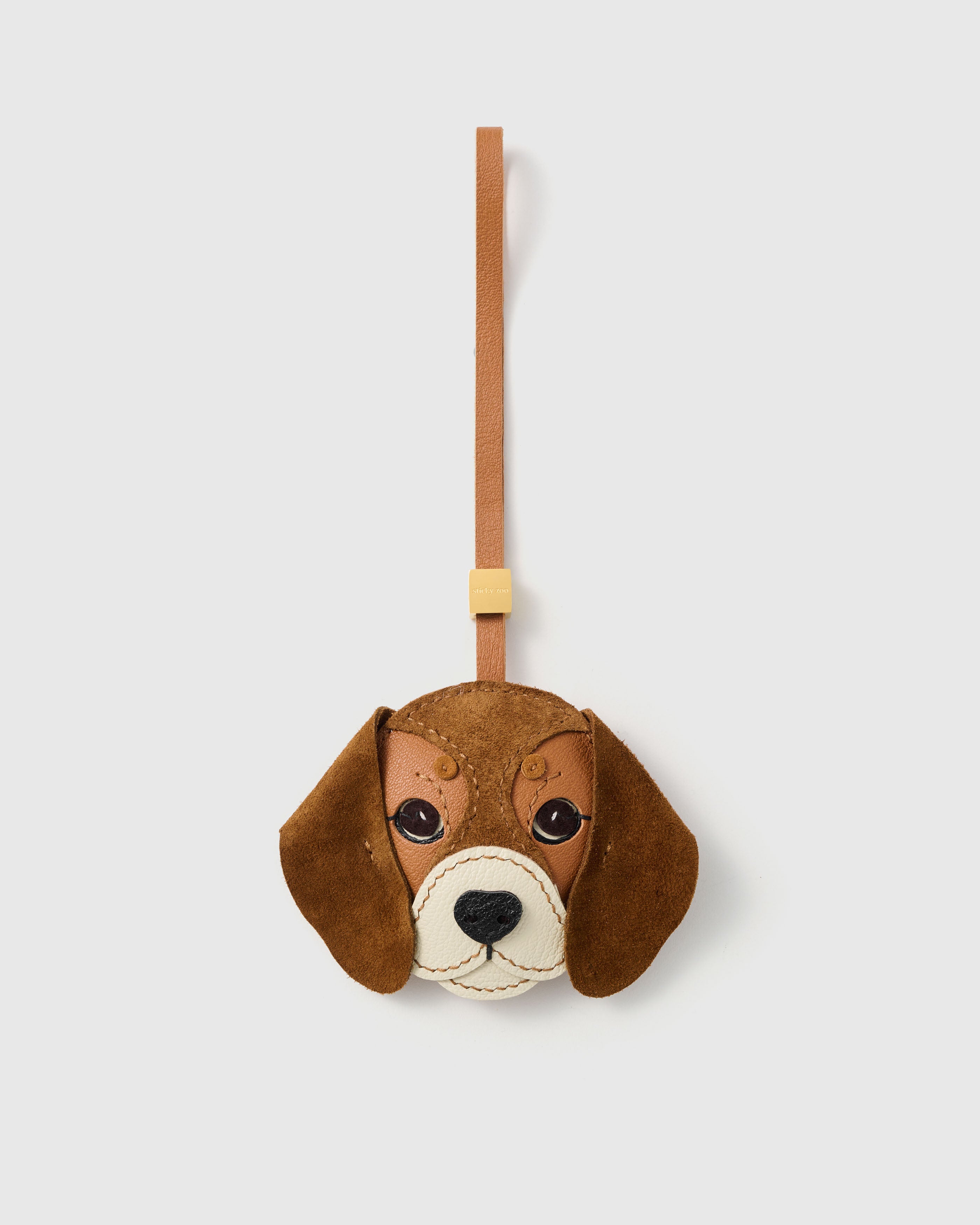 Handmade STICKYZOO beagle charm in French Alran goatskin leather with alcantara suede floppy ears, tan leather strap, and 18K gold-plated hardware