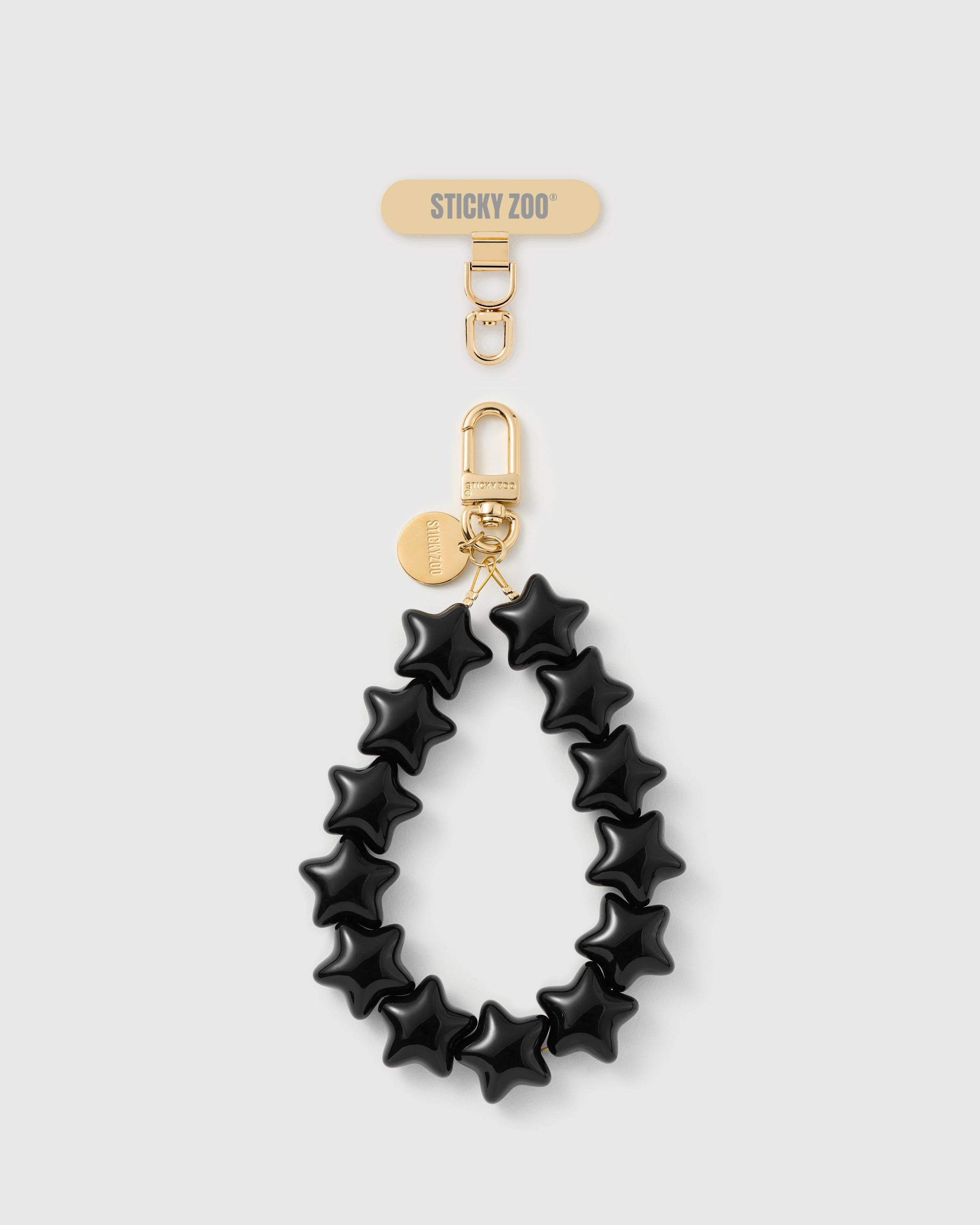 Handmade noir five-point star bead phone strap with 18K gold-plated carabiner and engraved STICKYZOO disc — Rated 4.9 stars