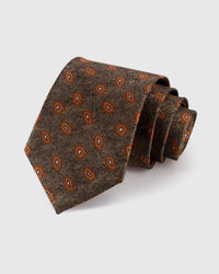 STICKYZOO BRONZE TEARDROP TIE — 100% mulberry silk with hand-embroidered amber-copper teardrop foulard motifs on warm bronze brown with herringbone texture ground