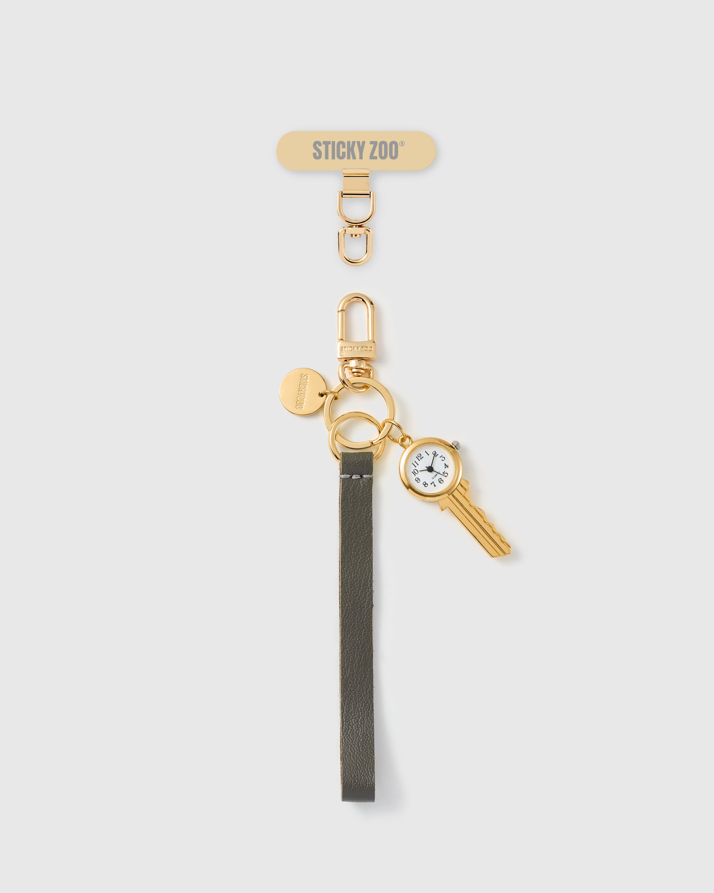 Handmade French Alran grey leather phone strap with gold key charm and working watch face, engraved STICKYZOO hardware