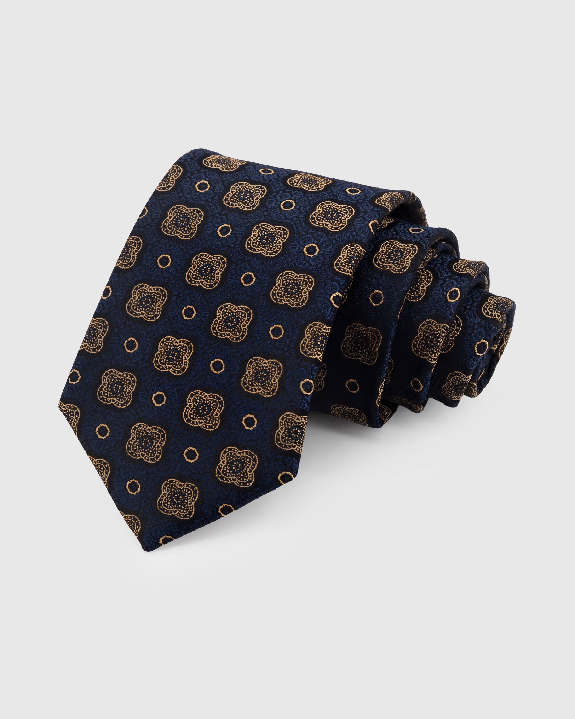 STICKYZOO Navy Quatrefoil Tie in hand-embroidered mulberry silk with gold quatrefoil medallion motifs, 45° bias-cut Italian method